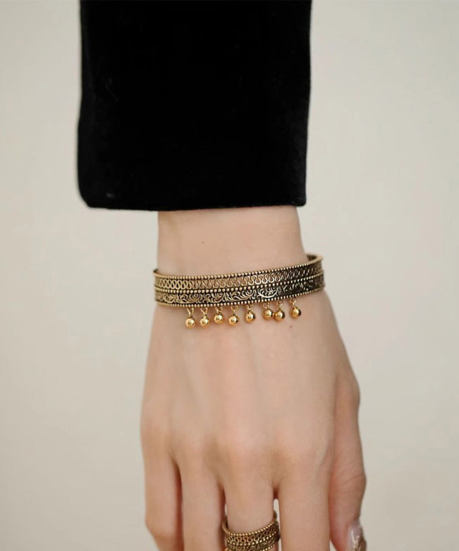 Vintage Ancient Gold Hollow Out Patchwork Tassel Cuff