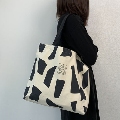 Zippered Canvas Handbag With Artistic Design