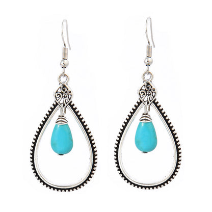 Turquoise Tassel Earrings with Geometric Metal Design