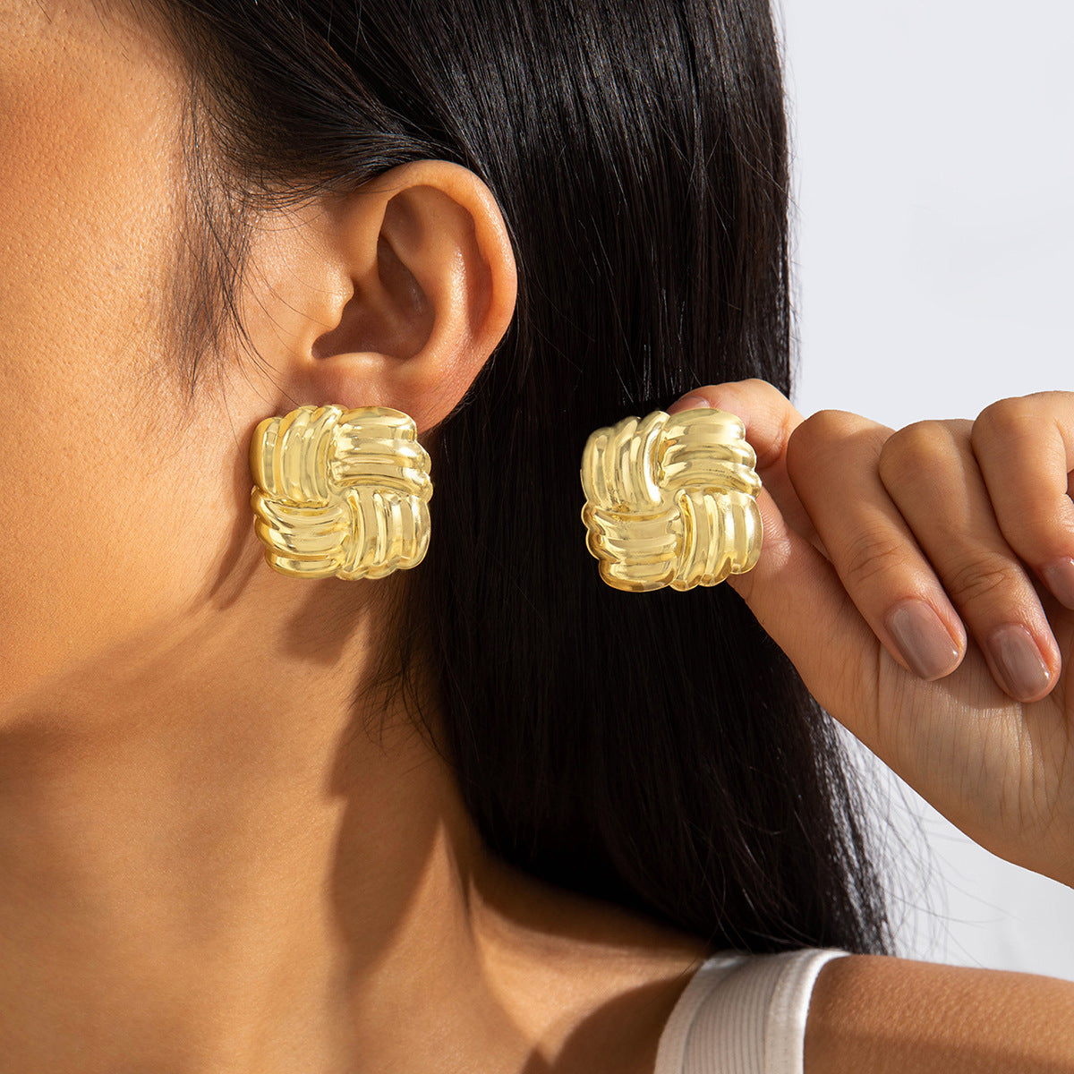 Geometric Gold Drop Earrings With Twisted Design