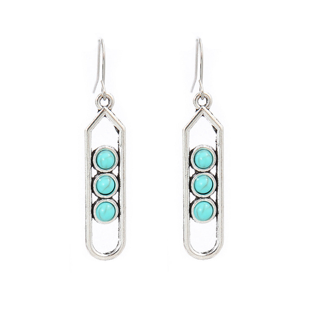 Turquoise Tassel Earrings with Geometric Metal Design