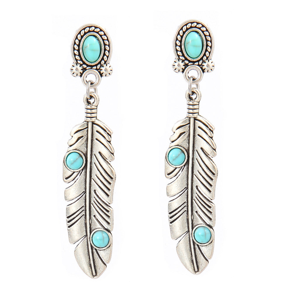 Turquoise Tassel Earrings with Geometric Metal Design