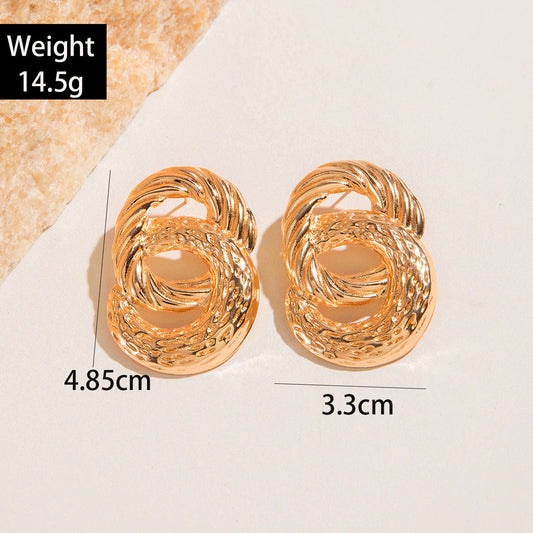 Geometric Gold Drop Earrings With Twisted Design