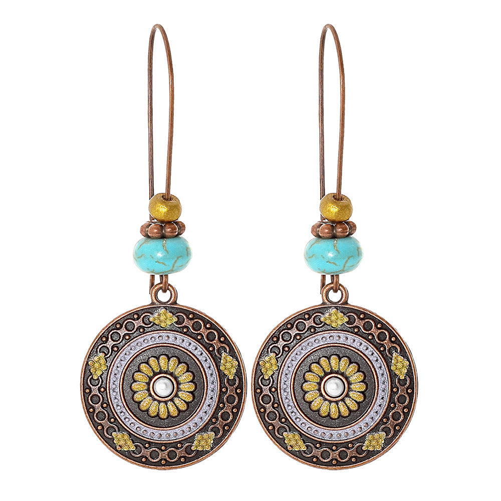 Bohemian Vintage Inspired Earrings with Feather and Tassel Elements