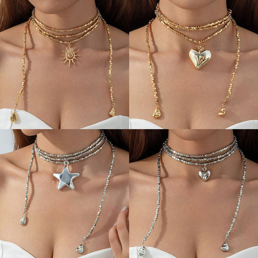 Long Layered Necklace With Diamond Accents And Geometric Pendants