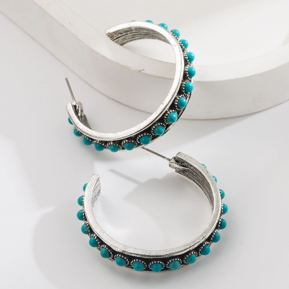 Exaggerated C-Shaped Earrings with Turquoise Accent