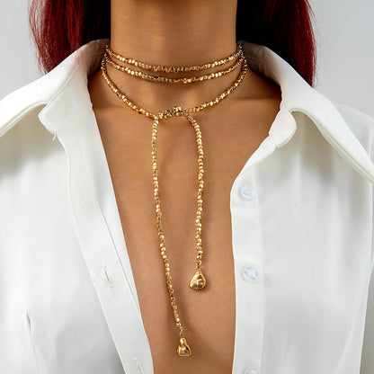 Long Layered Necklace With Diamond Accents And Geometric Pendants