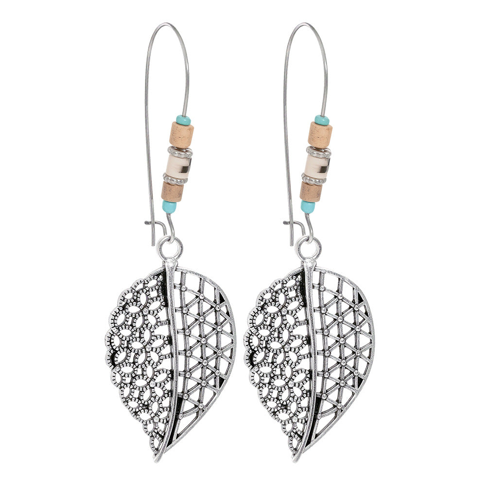Turquoise Tassel Earrings with Geometric Metal Design