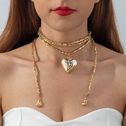 Long Layered Necklace With Diamond Accents And Geometric Pendants