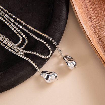 Long Layered Necklace With Diamond Accents And Geometric Pendants