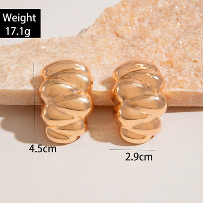 Geometric Gold Drop Earrings With Twisted Design