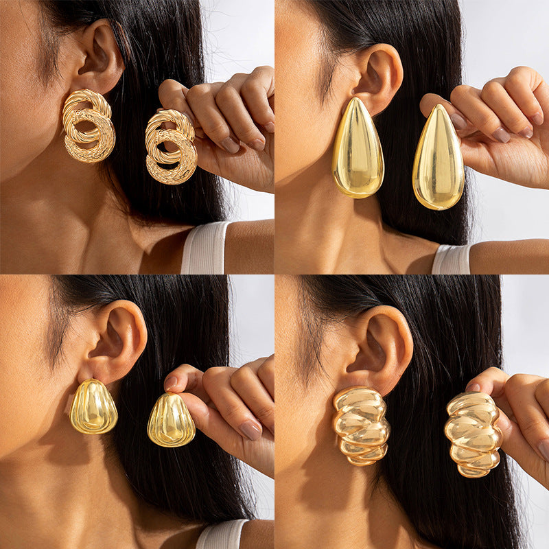 Geometric Gold Drop Earrings With Twisted Design