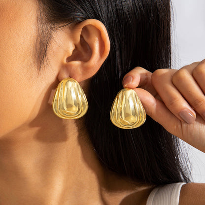 Geometric Gold Drop Earrings With Twisted Design