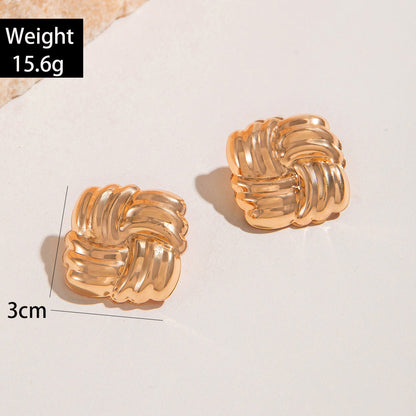 Geometric Gold Drop Earrings With Twisted Design