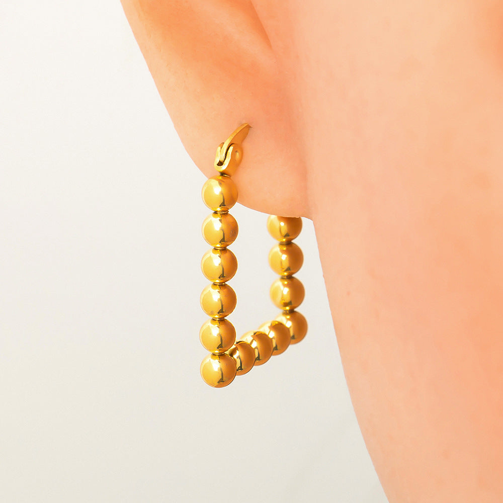 Fashionable Titanium Steel Heart Shaped Earrings with 18K Gold Plating