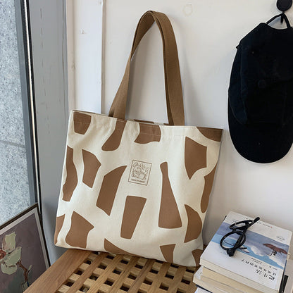 Zippered Canvas Handbag With Artistic Design