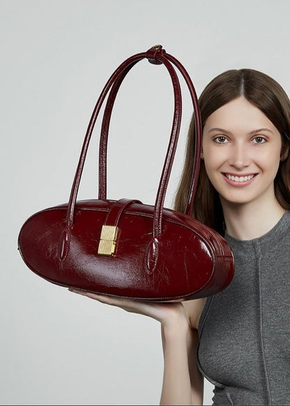 Oval Patent Leather Top Handle Structured Handbag