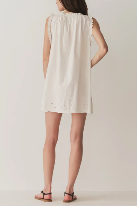 Short Skirt with Pearl Buttons and Scalloped Trim and Round Neck.