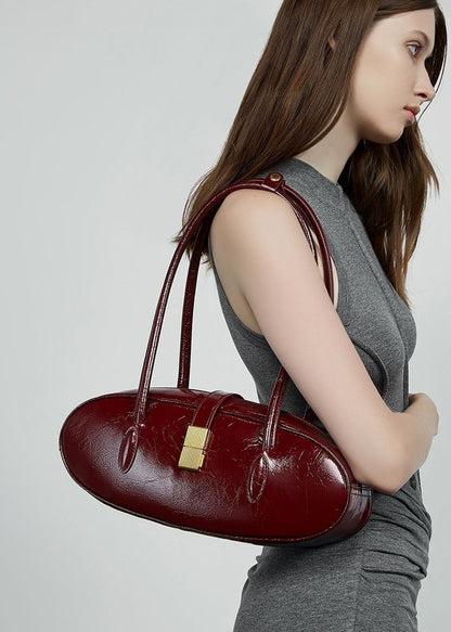 Oval Patent Leather Top Handle Structured Handbag